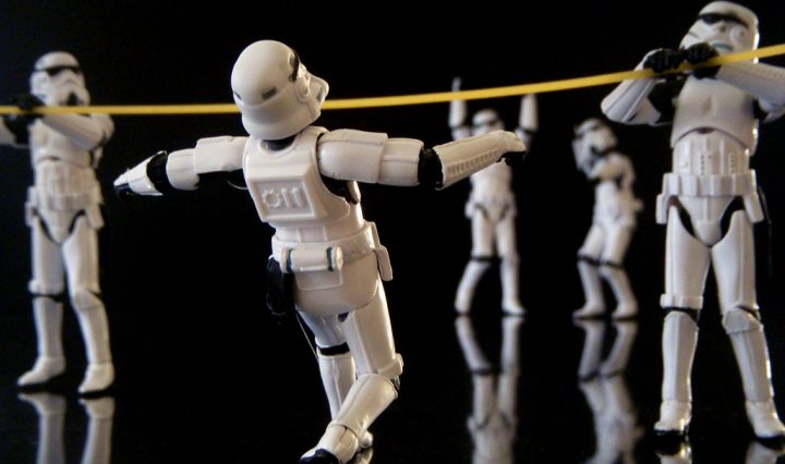 Storm Troopers do the limbo while others cheer them on