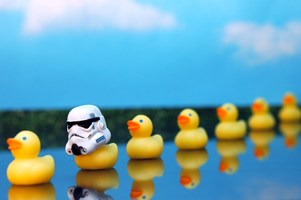 A row of rubber ducks with one that is wearing a Darth Vader helmet to symbolize an error in a sequence