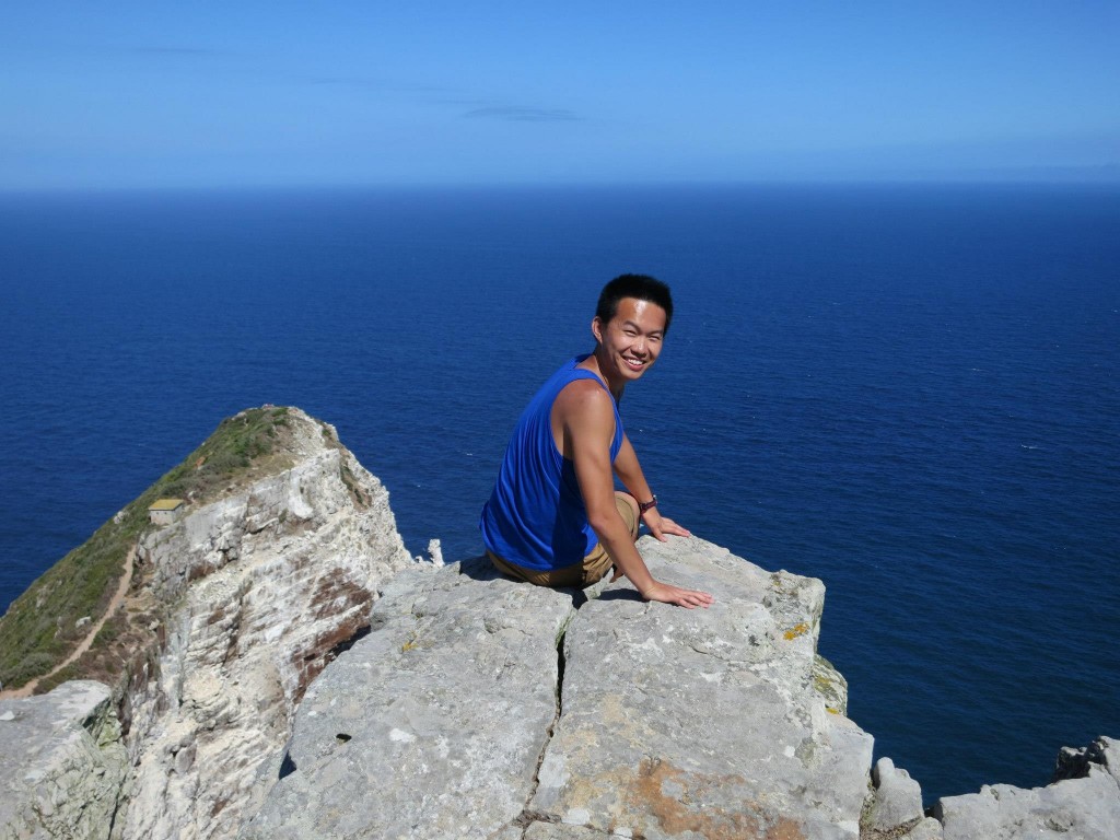 Andy Chu, Baruch Alumni, on a mountain in Cape Town, South Africa.